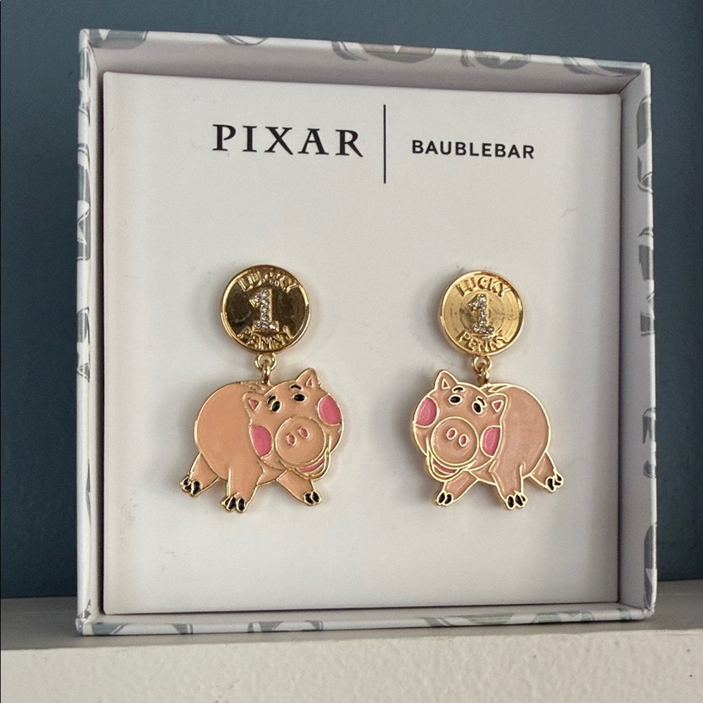 BaubleBar Pixar Hamm Earrings - Gold and Pink
